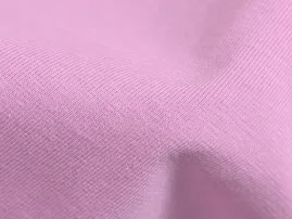 Textured pique knit fabric with raised waffle-like pattern