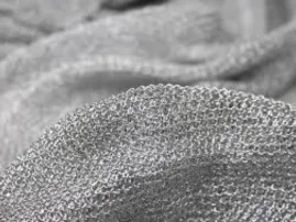 Shimmery silver knit fabric with metallic sheen