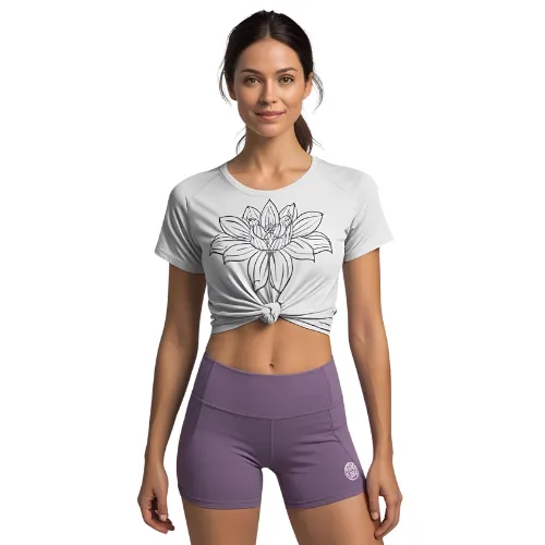 Woman wearing a printed yoga crop top with high-waisted shorts, manufactured by RYZEAL, an apparel sourcing and manufacturing company in Bangladesh