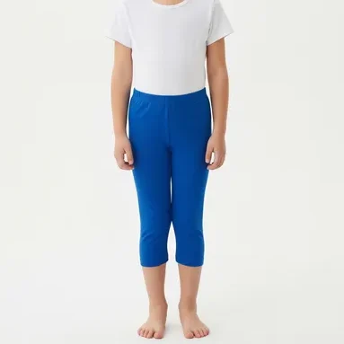 Young girl wearing bright blue mid-calf leggings with a white t-shirt, showcasing RYZEAL as a kid's mid calf leggings manufacturer in Bangladesh.