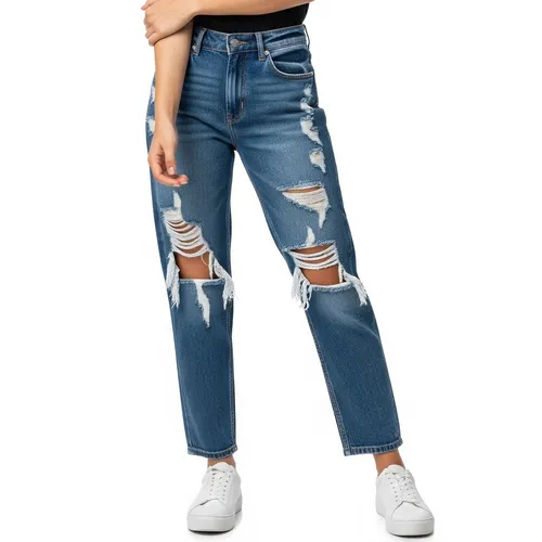 Distressed wholesale jeans for women with ripped details manufactured by RYZEAL SOURCING in Bangladesh.