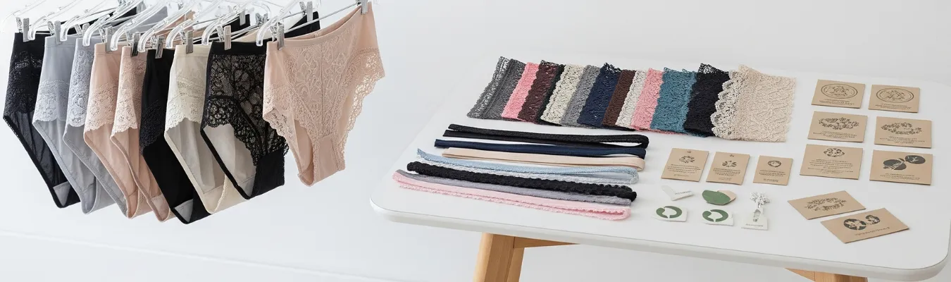 Assorted wholesale briefs for women with lace details displayed alongside trims and packaging samples, representing RYZEAL’s focus on ethical production, compliance, and quality control as a sourcing company in Bangladesh.