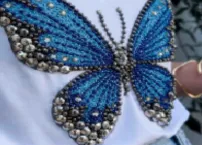 Zardozi embroidery featuring metallic threads and embellished detailing.