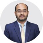 Portrait of a senior executive from RYZEAL Sourcing wearing a formal suit, representing leadership at a leading apparel manufacturing and sourcing company in Bangladesh.