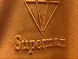 Embossing technique creating raised patterns on leather and fabric surfaces.