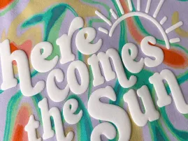 Puff printing technique producing raised, foam-like textured graphics.