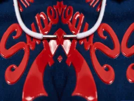 Silicone printing technique used for raised, rubber-like designs on apparel.